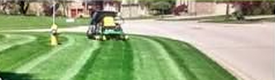 Weekly lawn mowing on a residential street in London, Ontario